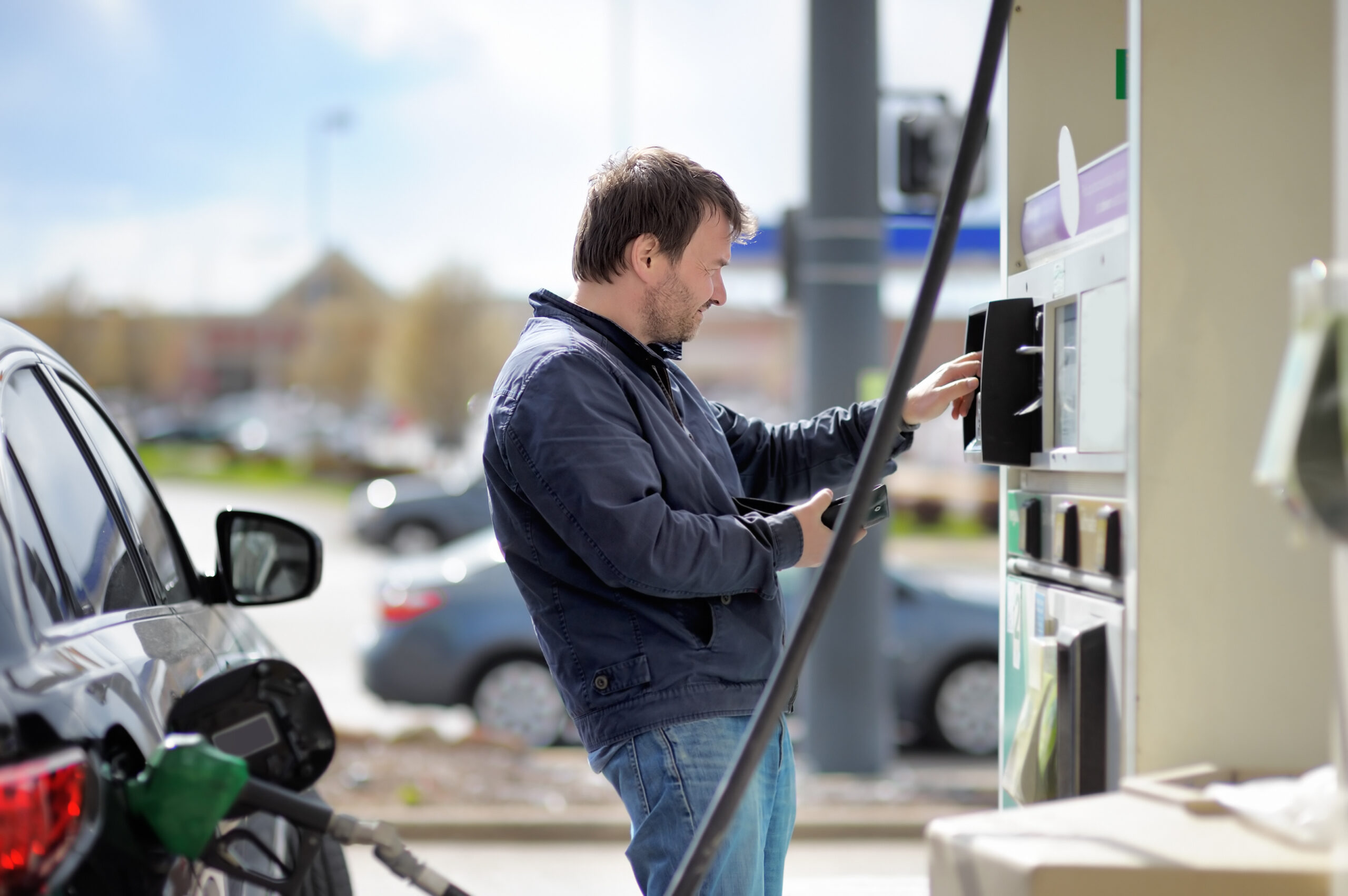 Man filling gasoline fuel EMV Compliance
